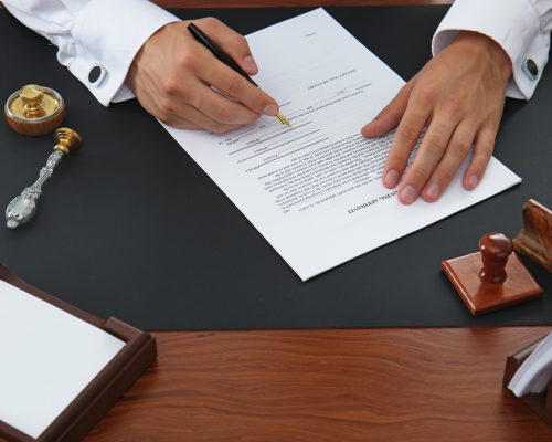 Notary public signing document in office